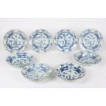 A set of eight 19th century Chinese blue and white bowls
each painted with a central panel of