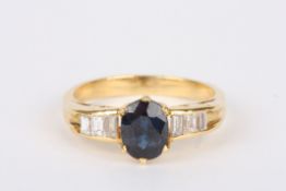 A sapphire and diamond ringset with large central oval sapphire, flanked either side by three small
