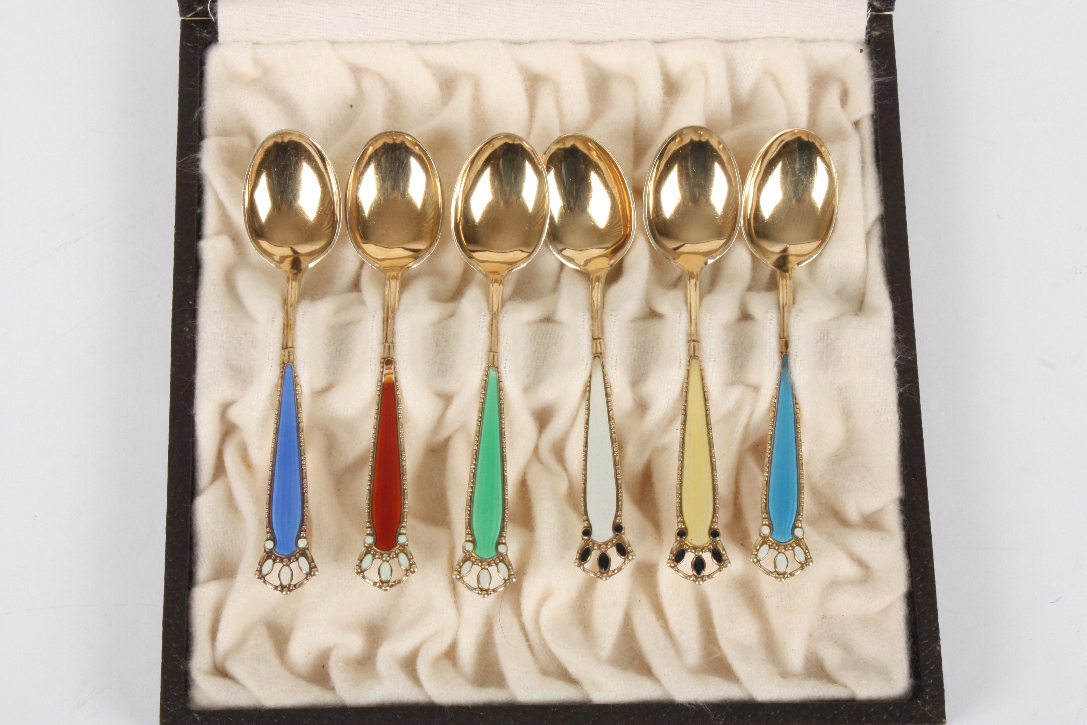 A set of six Norwegian silver gilt and enamel spoons
in a fitted case, retailed by Birger Olberg, - Image 2 of 2