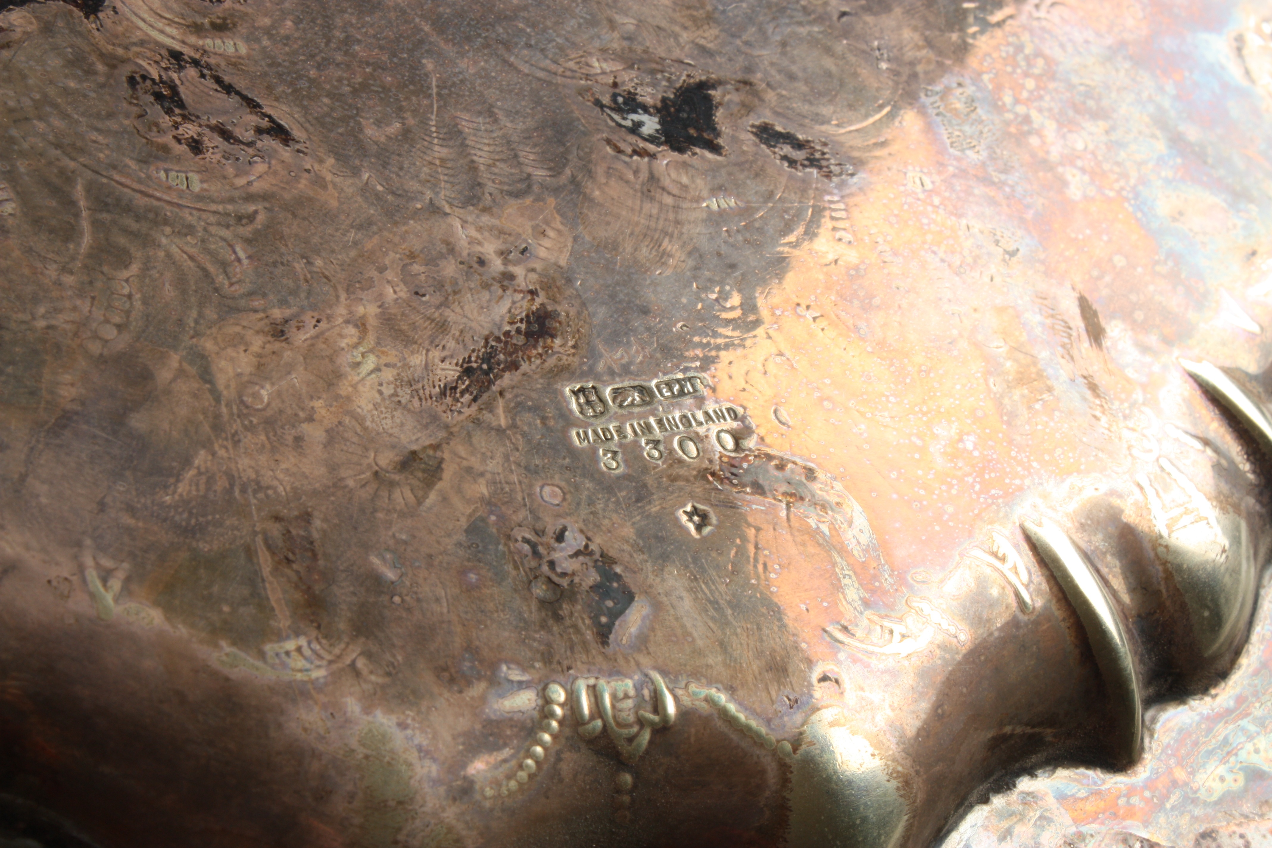 A silver plated tray
of pie-crust form, decorated with scrolls and foliageDimensions: diameter - Image 3 of 3