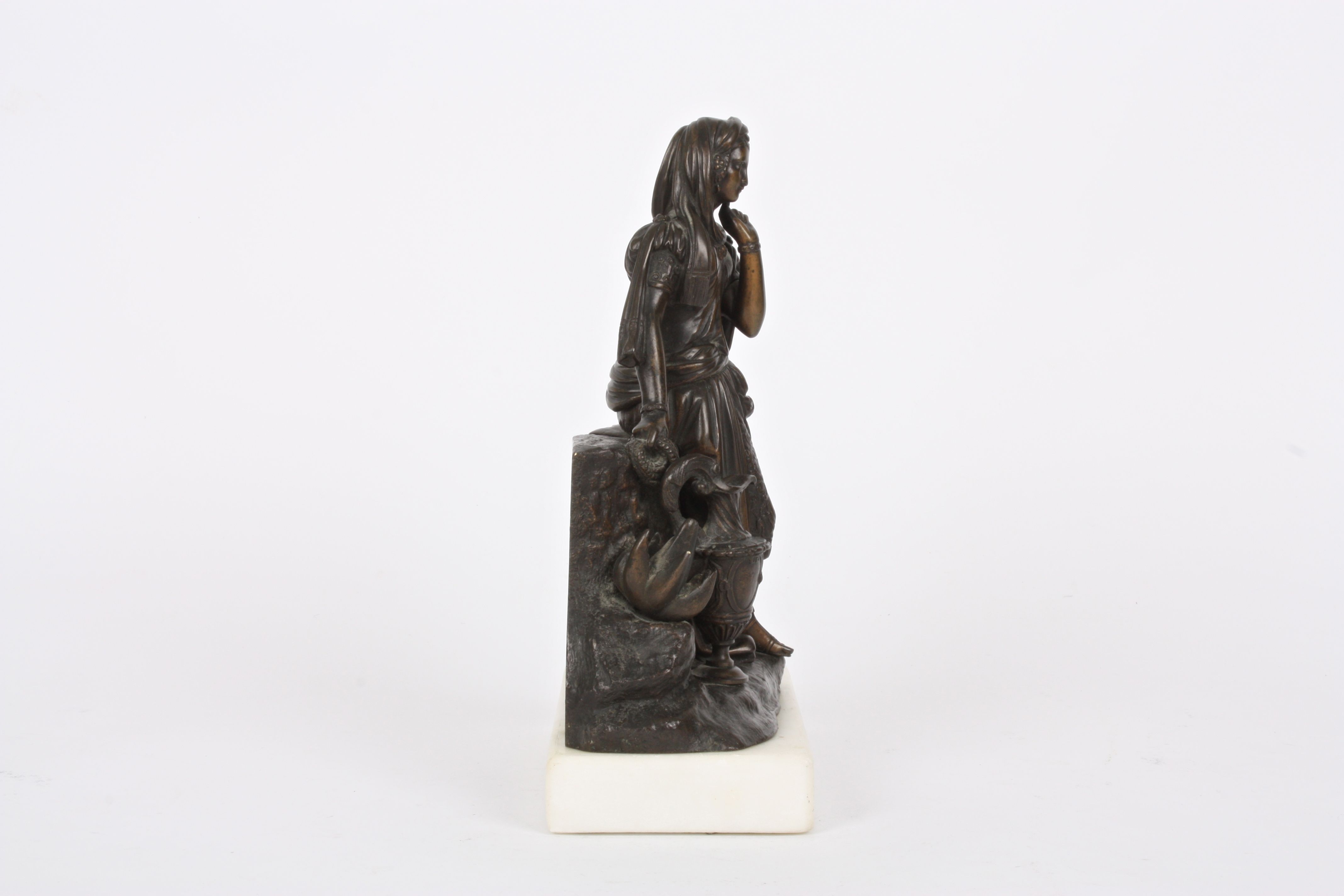 A 19th Century French bronze girl
stood wearing flowing robes stood beside a rocky pedestal and a - Image 4 of 4