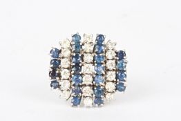 A large 18ct white gold, sapphire and diamond cluster dress ringset with four rows of sapphires