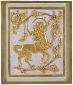 A framed gilt wood decorative panelthe mythical figure with outstretched arm amongst intertwined