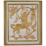 A framed gilt wood decorative panel
the mythical figure with outstretched arm amongst intertwined