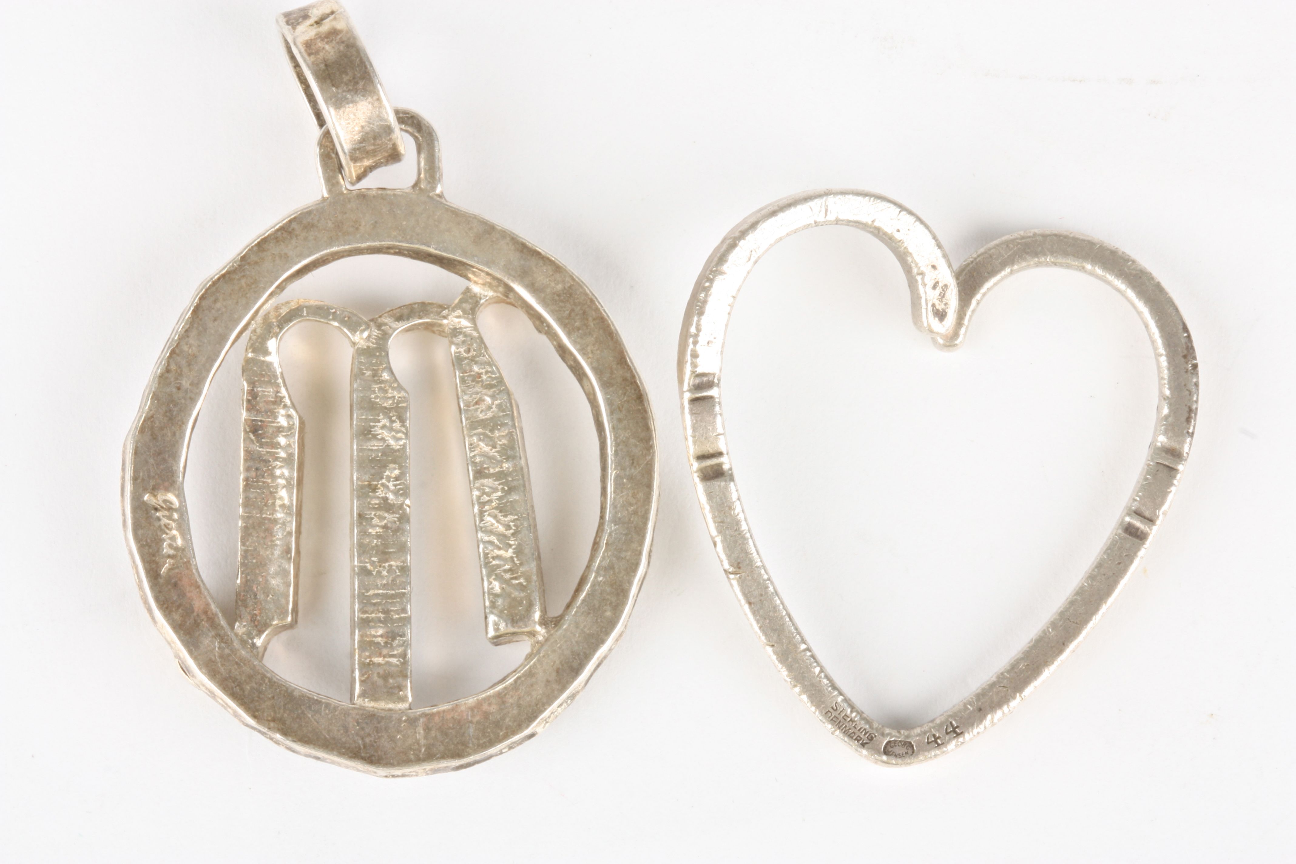 A Georg Jensen silver heart shaped pendant
together with another silver pendant with applied Scorpio - Image 2 of 2