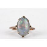 A 9ct gold and opal ring
the oval opal in an eight claw plain setting.Dimensions: Size N.Condition