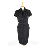A dark navy Christian Dior silk dress
with ruche v-neck top, short sleeves, with five decorative