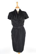 A dark navy Christian Dior silk dresswith ruche v-neck top, short sleeves, with five decorative