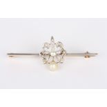 An Edwardian gold, diamond and pearl bar brooch
set with floral motif crested by a pearl, on a