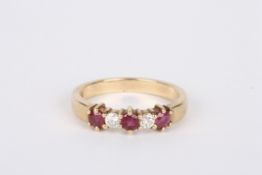 A 9ct gold, ruby and diamond five stone ring, set with three rubies interspersed with two
