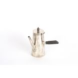 A George V Asprey silver chocolate pot
hallmarked Birmingham 1916, with ebonised handle and knop and