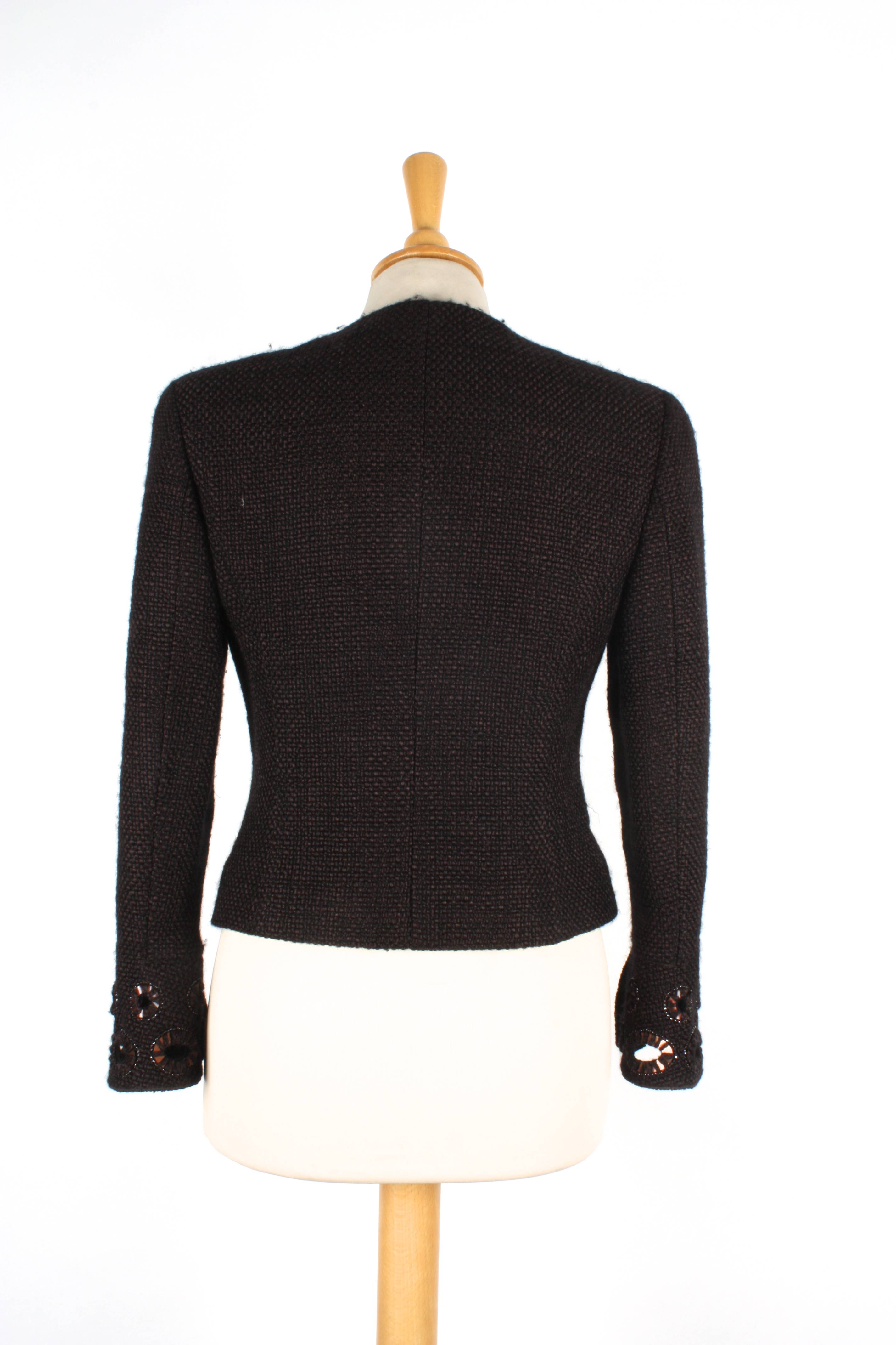 A brown Chanel wool jacket
with zip to front and two pockets to breast, with cut out patterns with - Image 2 of 2