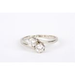 A two stone 18ct gold and platinum ring
set with two diamonds in claw setting, each diamond