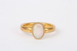 A 22ct gold and opal ringwith Birmingham hallmark, with rubover setting and plain shank.Dimensions:
