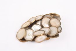 A collection of Regency mother-of-pearl buttonseach carved with floral motif to centre, and leaf