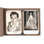 Autographs. An autograph book containing a number of photographs of film stars
some signed, some