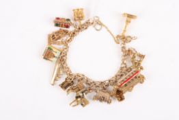 A 9ct gold charm bracelet with fifteen charms all of London landmarks including Nelson's Column, St