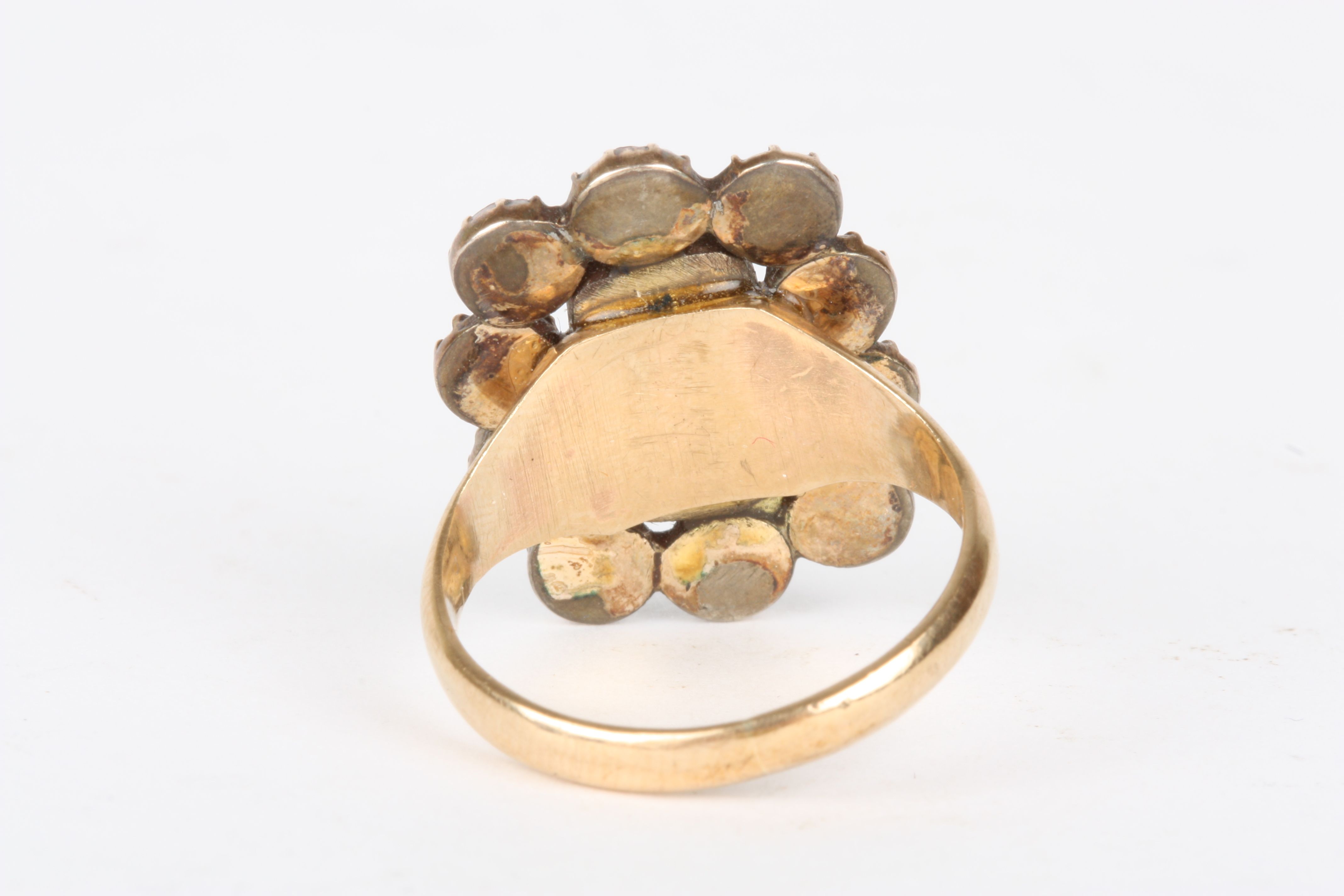 A gold and garnet mourning ring
set with a central panel of woven hair surrounded by ten faceted - Image 2 of 2