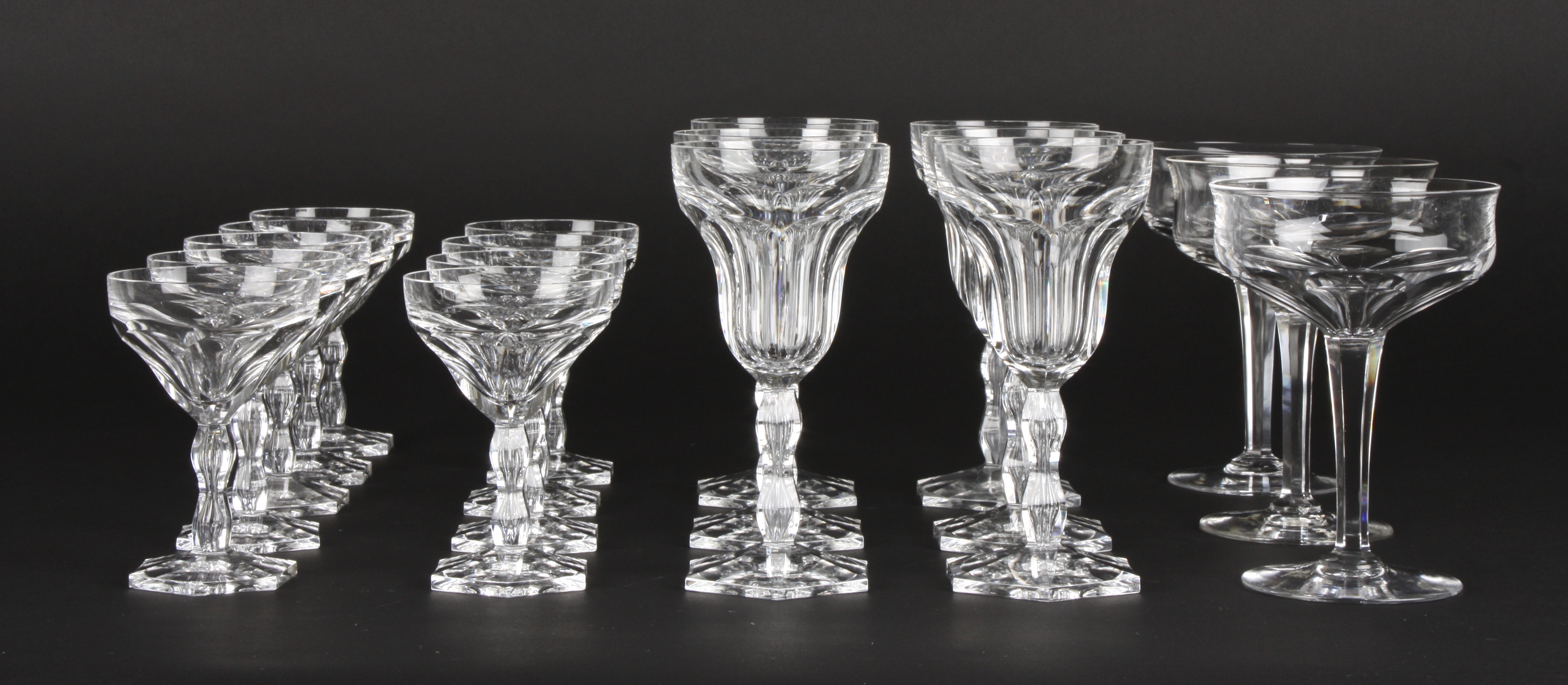 Two sets of cut glass drinking glasses
comprising six wine glasses and nine smaller sherry