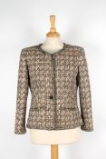 Four Chanel boucle jackets.comprising a grey and pink single breasted mix jacket with two front