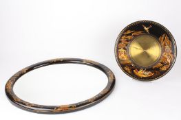 A Japanned aneroid barometer with a brass dial and similar mirrorretailed by A. R. Baines of