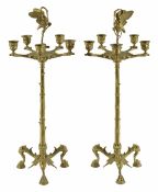 A large pair of late 19th century brass candlesticksContinentalboth with central cast figure of