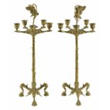 A large pair of late 19th century brass candlesticks
Continental
both with central cast figure of