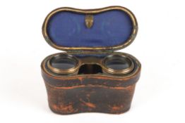 A pair of mother-of-pearl and brass opera glassesin fitted leather caseDimensions: Condition