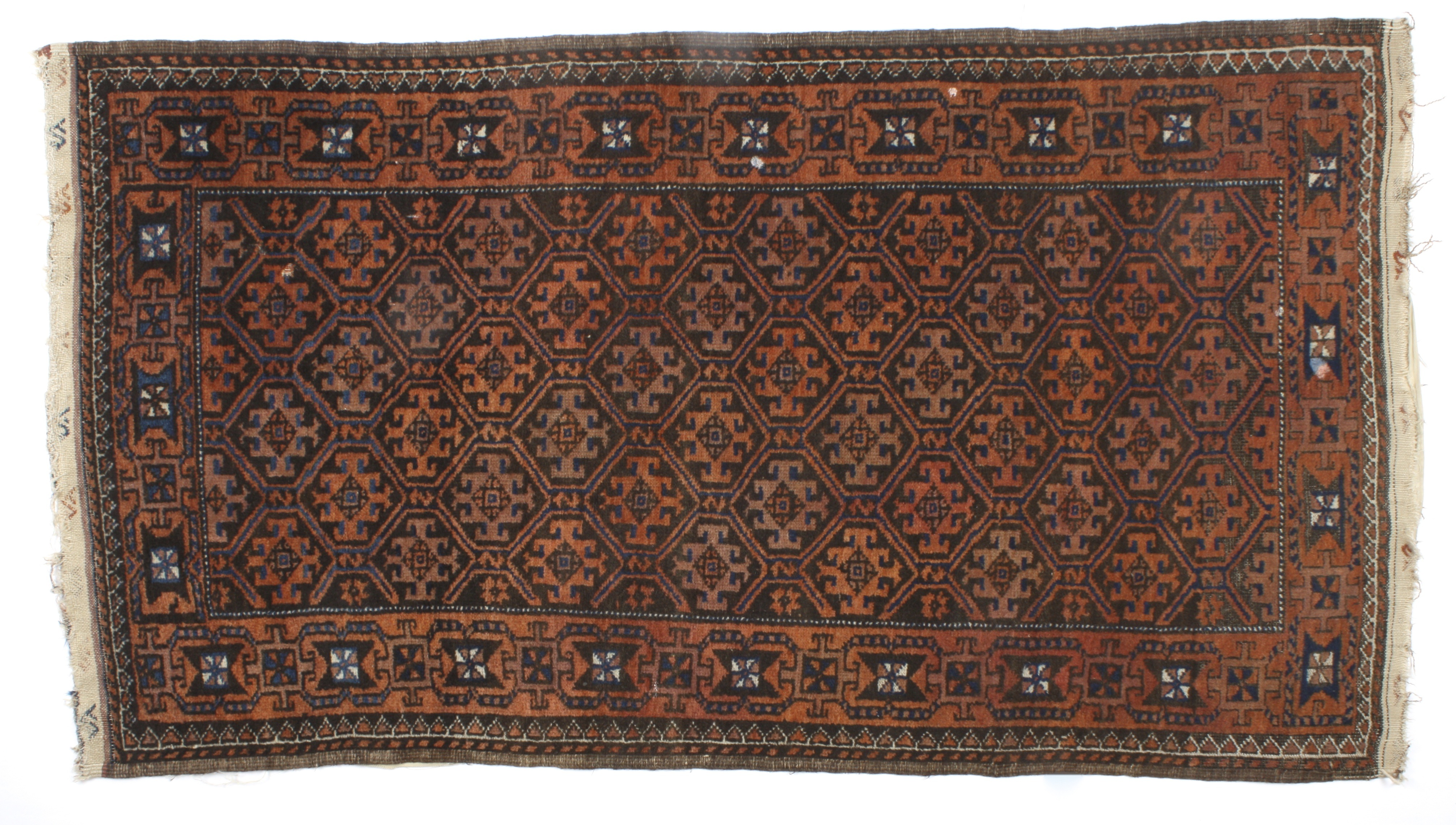 A small brown and red ground Persian rug
decorated with geometric designs on a brown field