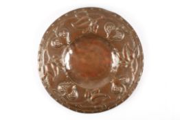 An Arts and Craft copper bowlwith embossed stylised flowers and foliage to rimDimensions: