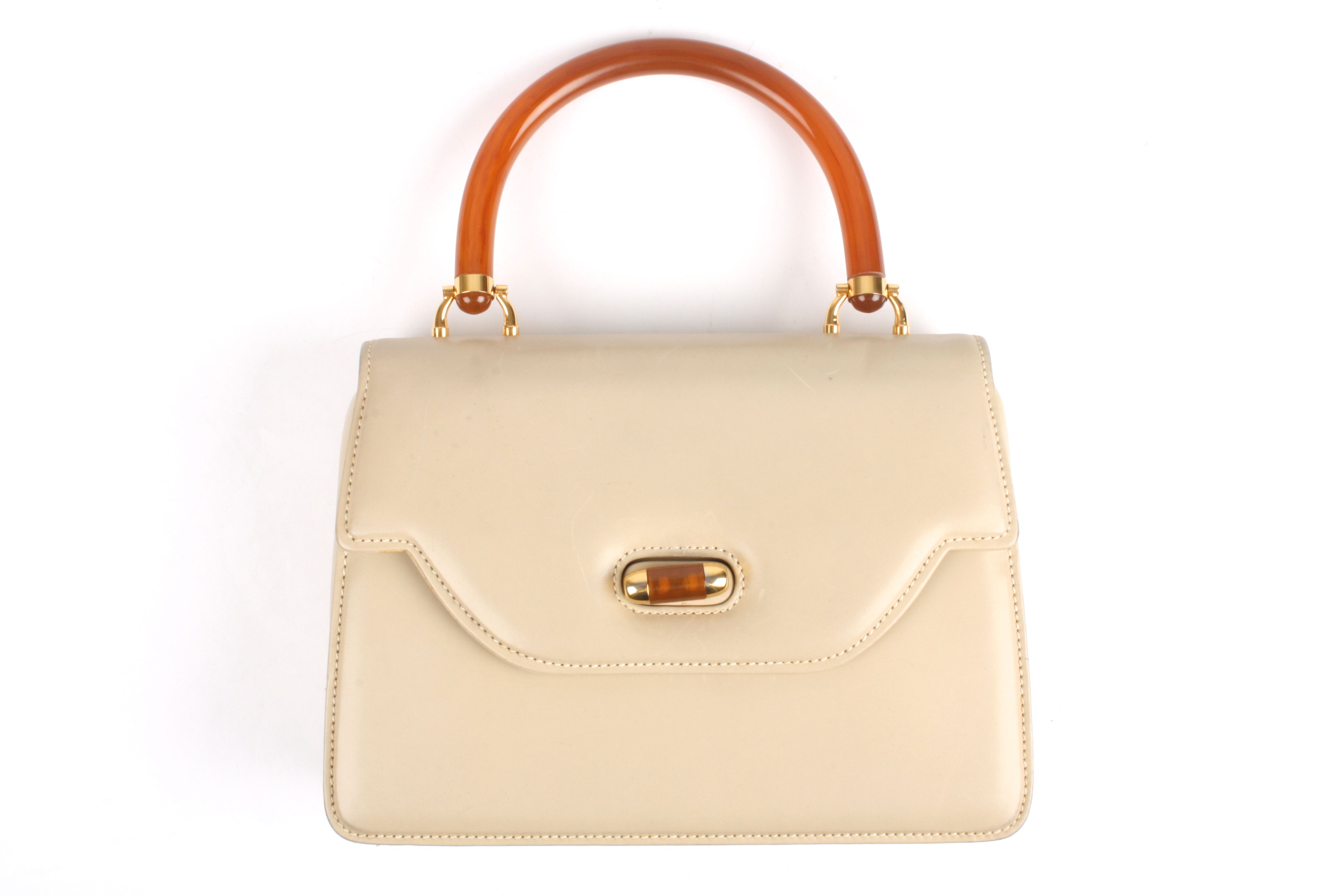 A 1970s Gucci leather handbag
the taupe leather bag with Gucci stamp to the interior, faux horn