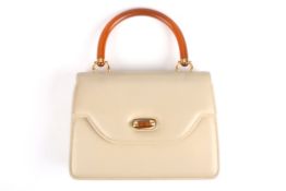 A 1970s Gucci leather handbagthe taupe leather bag with Gucci stamp to the interior, faux horn