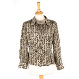 A collection of Chanel blouses
the first brown and black patterned vest top and matching blouse, the