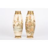 A pair of Japanese Satsuma vases
each of ovoid form and decorated with sprays of flowers upon a