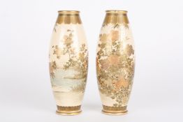 A pair of Japanese Satsuma vaseseach of ovoid form and decorated with sprays of flowers upon a