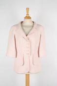 A Chanel pastel pink boucle jacket .with five logo buttons to front, European 38.Dimensions: