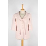 A Chanel pastel pink boucle jacket .
with five logo buttons to front, European 38.Dimensions: