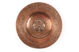 An Arts and craft Copper bowlwith hammered design and tendrils to edge, and embossed Tudor rose