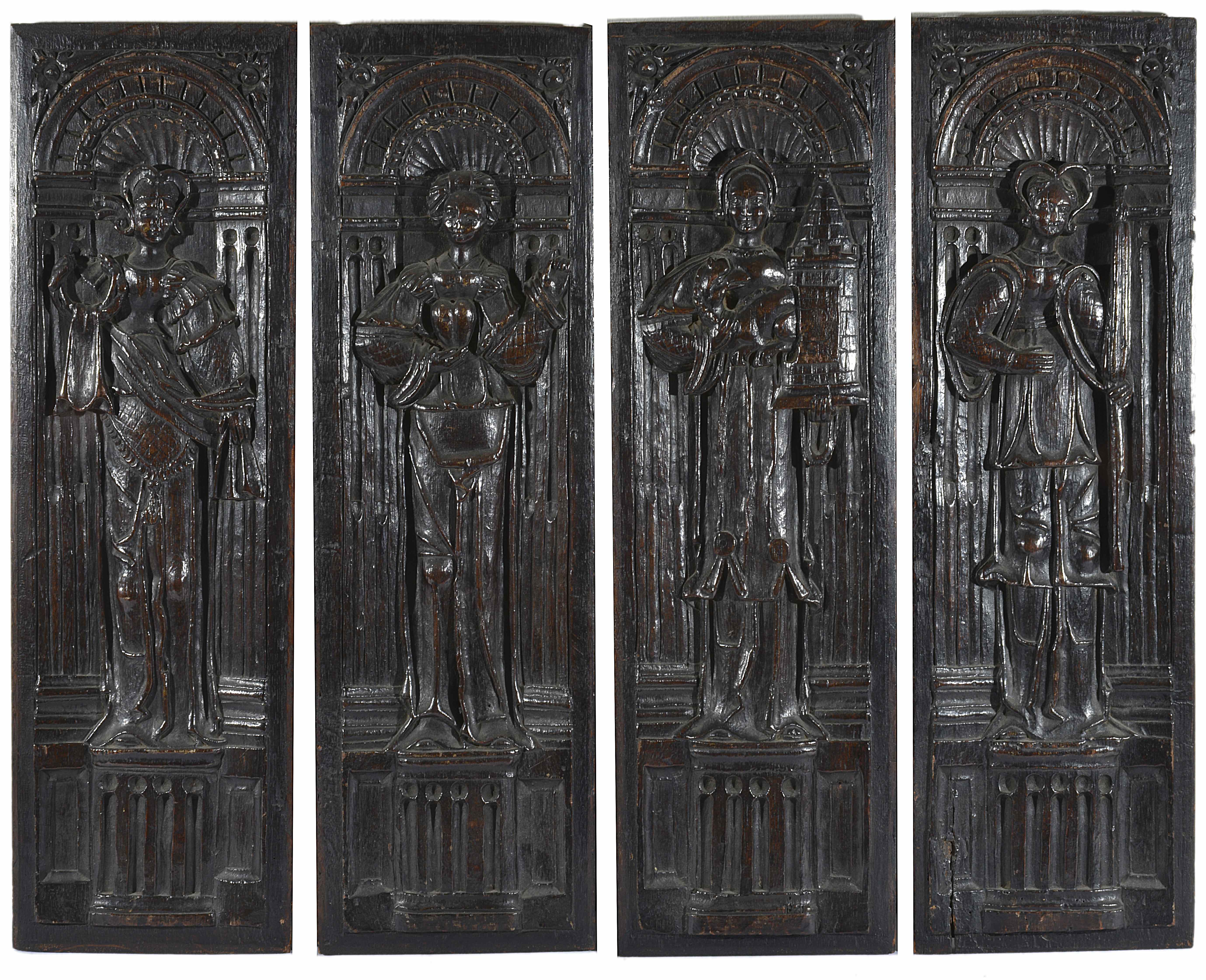Four carved oak panels
possibly late 16th century, Flemish
with carvings in high relief depicting