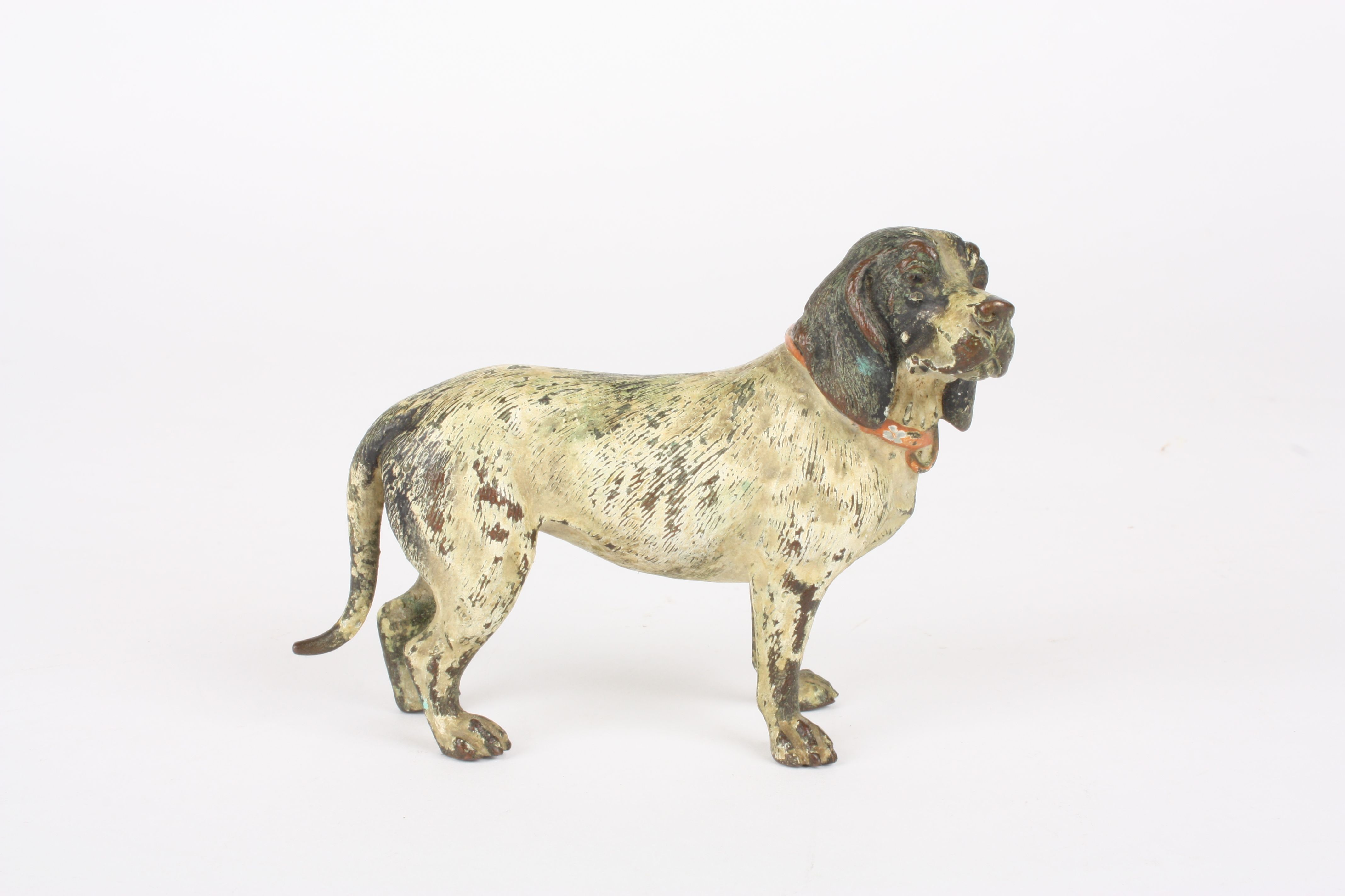 An Austrian cold painted figure of a spaniel
in the manner of Bergman, realistically painted in a