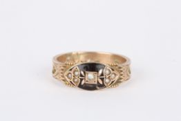 A 19th century mourning ring set with oval black enamel panel with seed pearls, the shank with