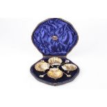 A set of six Victorian silver gilt shell shaped salts hallmarked London 1895, together with matching