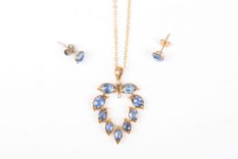 A sapphire and gold pendant and earringsthe pendant formed as sapphire set leaves, together forming