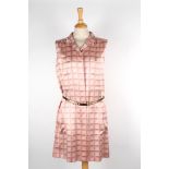 A Chanel silk shirt sleeveless dress
the pale pink dress with printed logos throughout, and matching