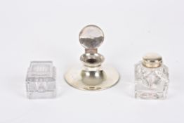 An Edwardian silver capstan inkwell hallmarked Birmingham 1908; together with a silver and glass