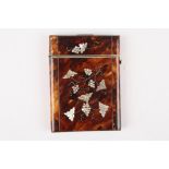 A Victorian tortoiseshell and mother of pearl card case
inlaid with grapes and vines on both sides