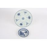 A 19th century Chinese circular blue and white plate, decorated with six panels of flowers with