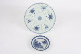 A 19th century Chinese circular blue and white plate, decorated with six panels of flowers with