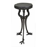 A late 19th/early 20th century cast iron tripod stand
the wooden circular top with a cast band