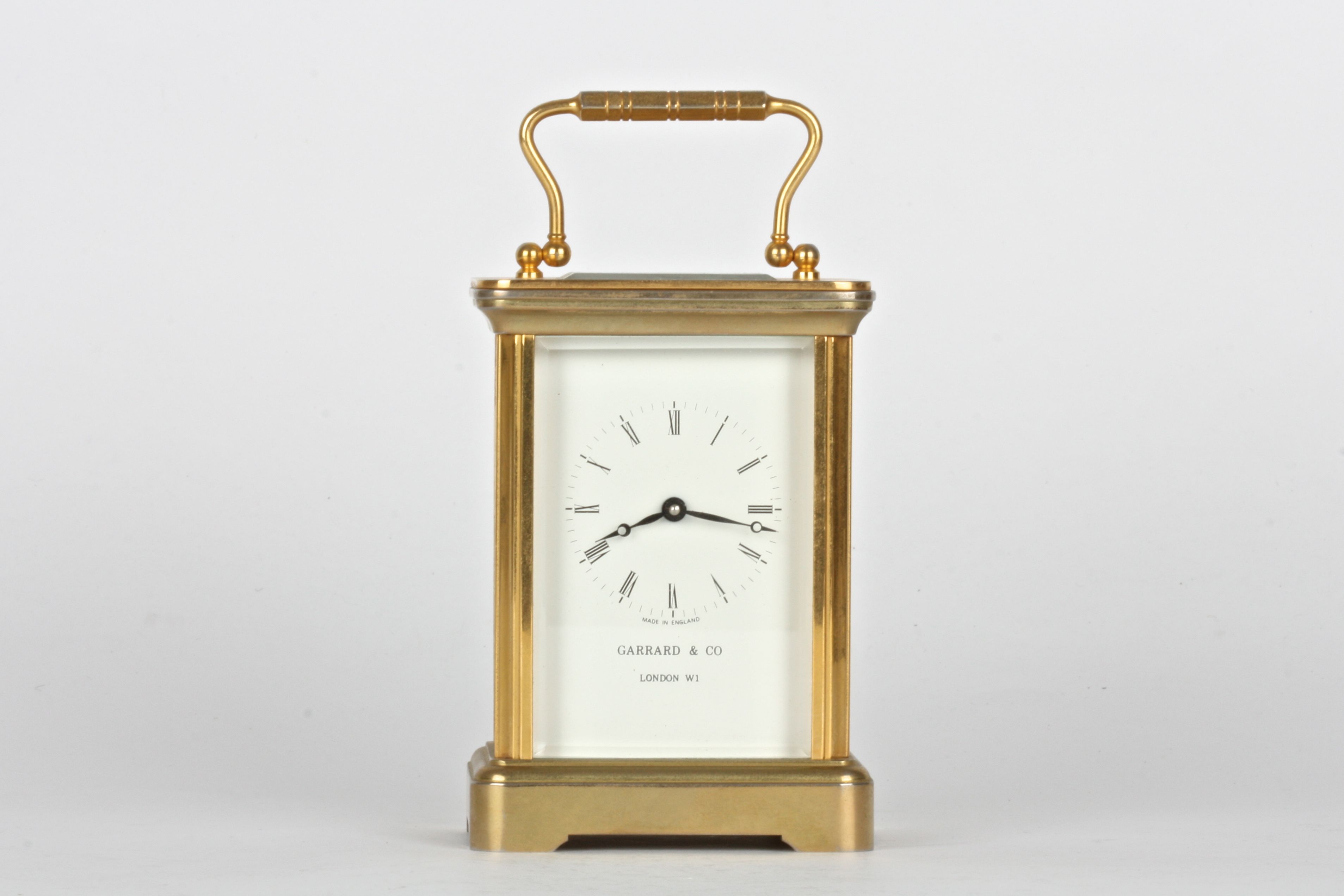 A 20th century Garrard & Co. brass carriage clock
with white dial and black Roman numerals, the dial